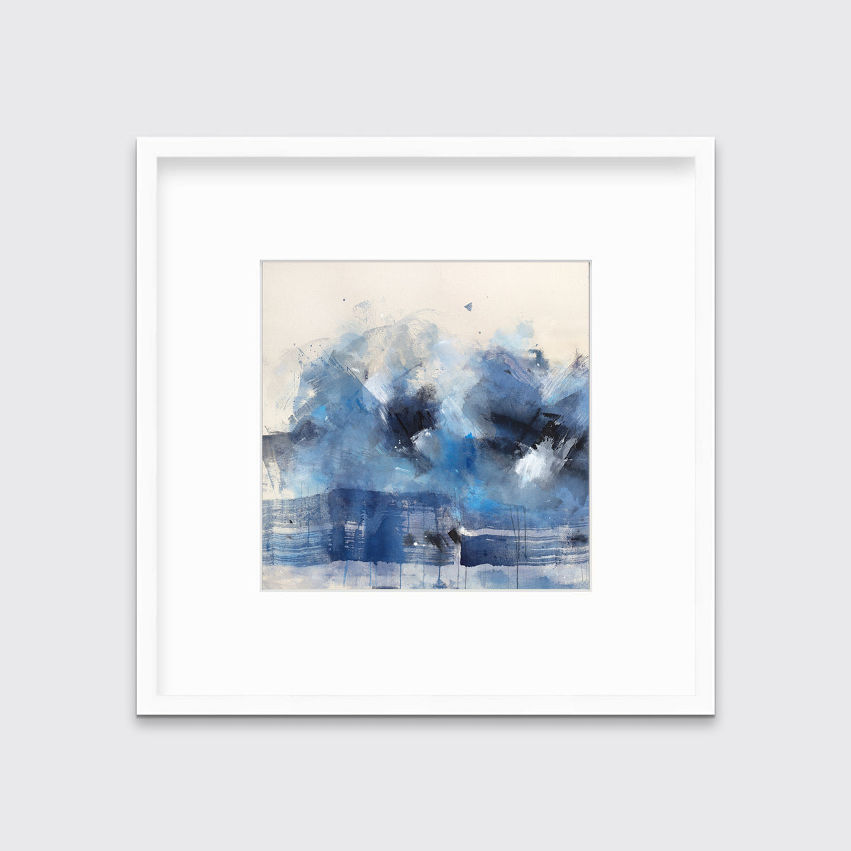 A blue, beige, white and black abstract print in a white frame with a mat hangs on a white wall.