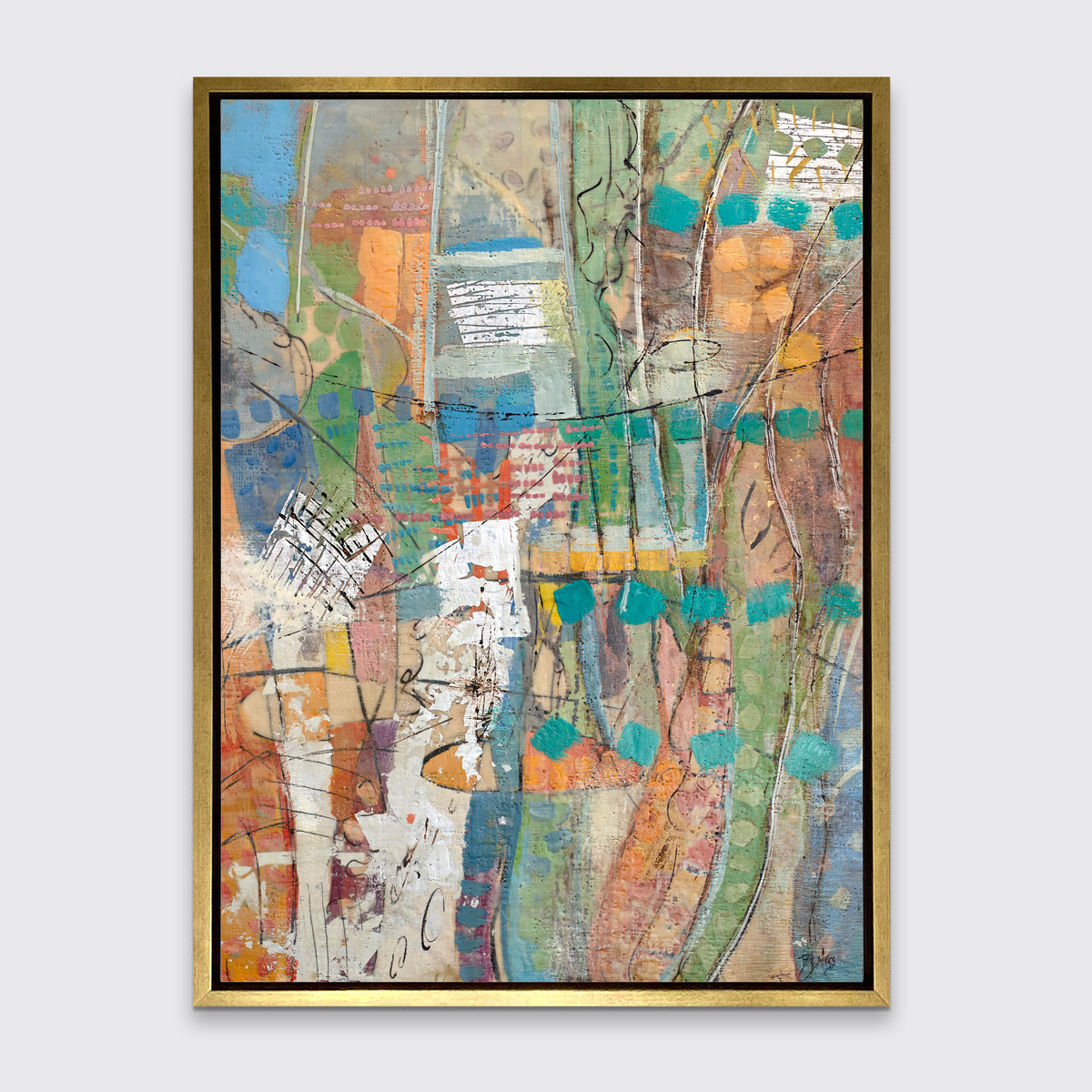 An abstract linear and geometric multicolored print staged in a gold floater frame on a wall.