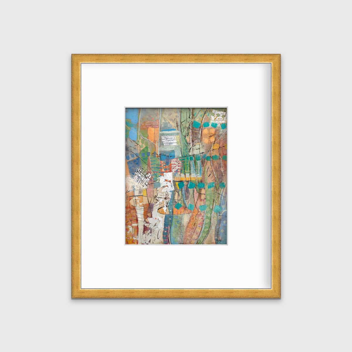 An abstract multicolored print in a gold frame with a mat hangs on a white wall.