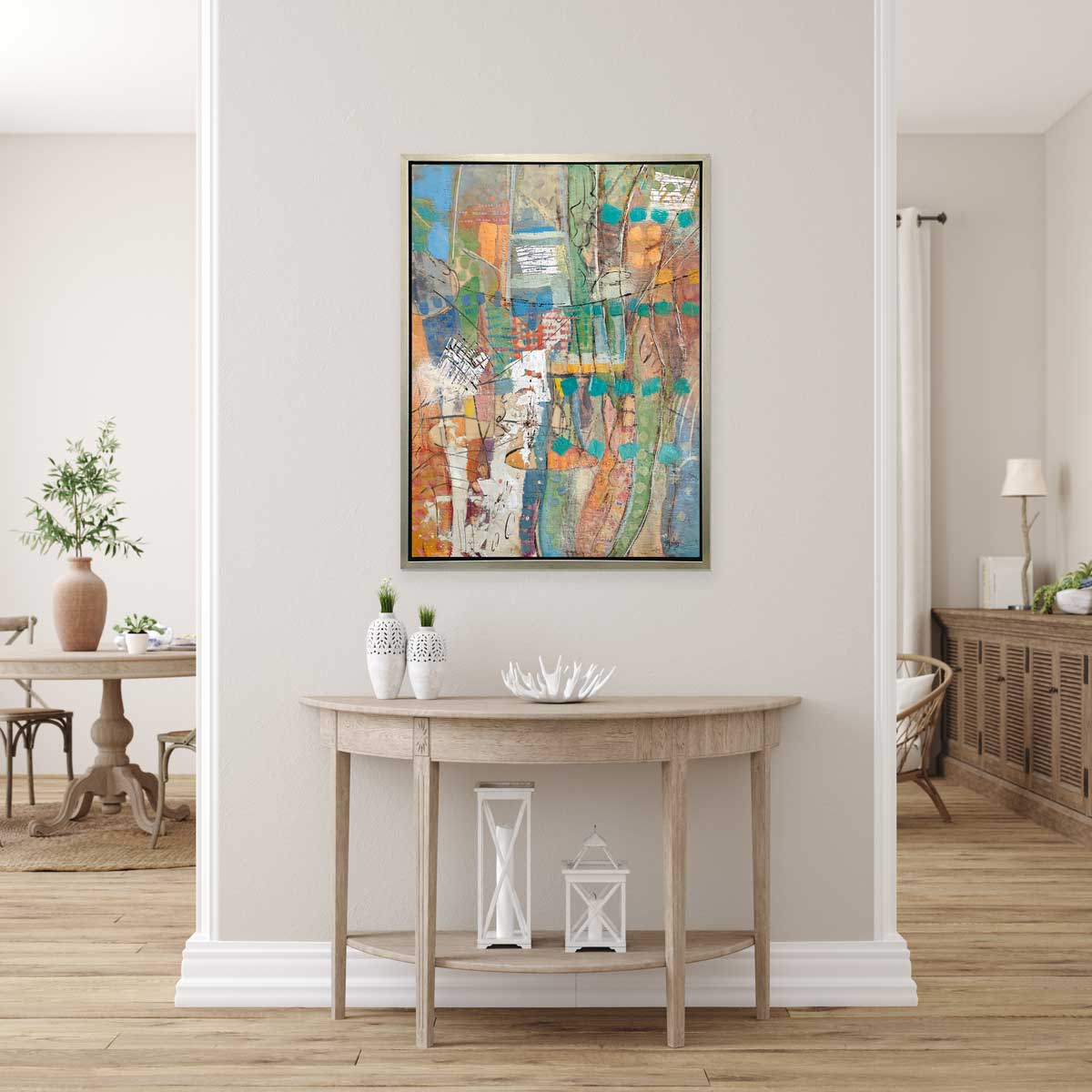 A Linda Bigness print in a sliver floater frame up in an entry way over a wooden table.