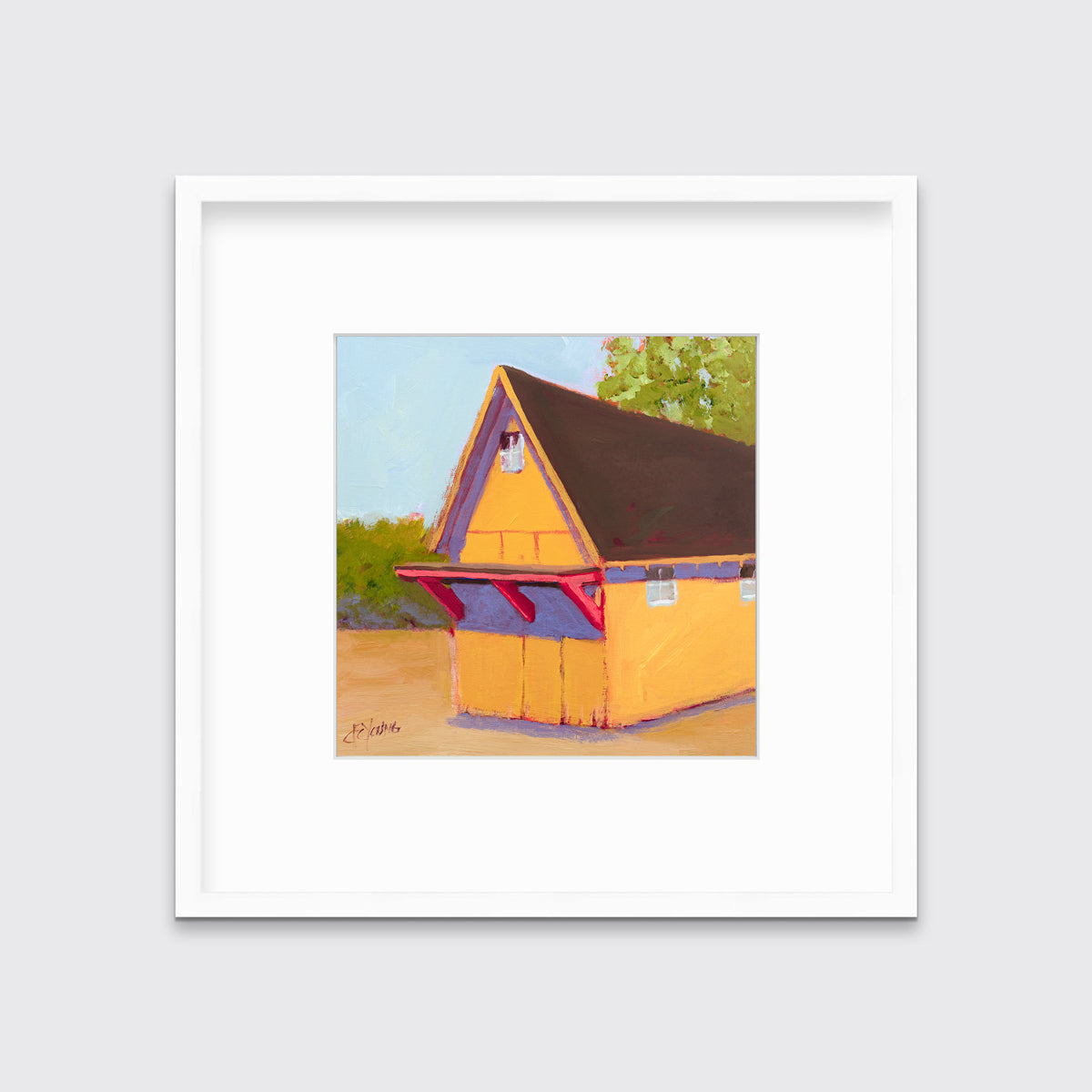 A yellow, orange, lavender and blue contemporary barn print in a white frame with a mat hangs on a white wall.
