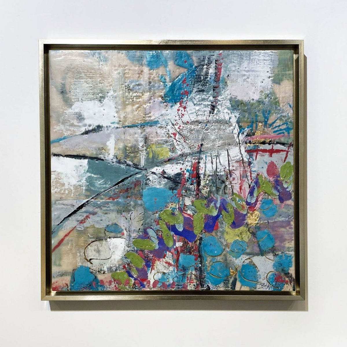 A framed abstract encaustic painting by Linda Bigness hangs on a white wall.