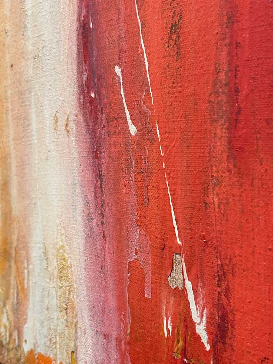 A close up of red, white and yellow paint.