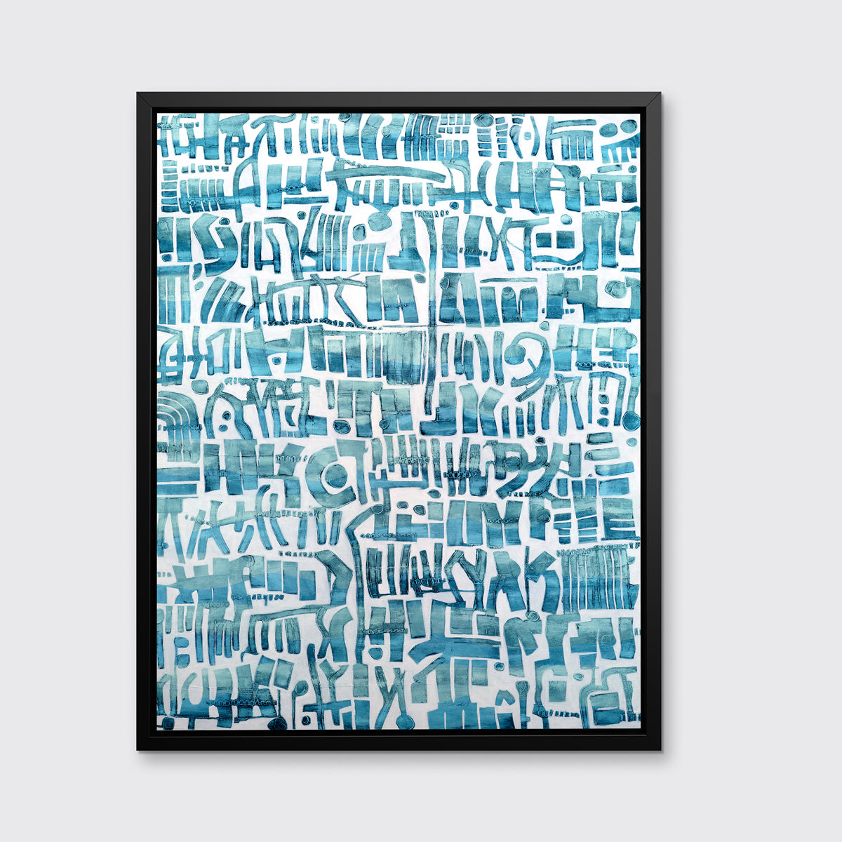 A teal and white abstract shapes print in a black floater frame hangs on a white wall.