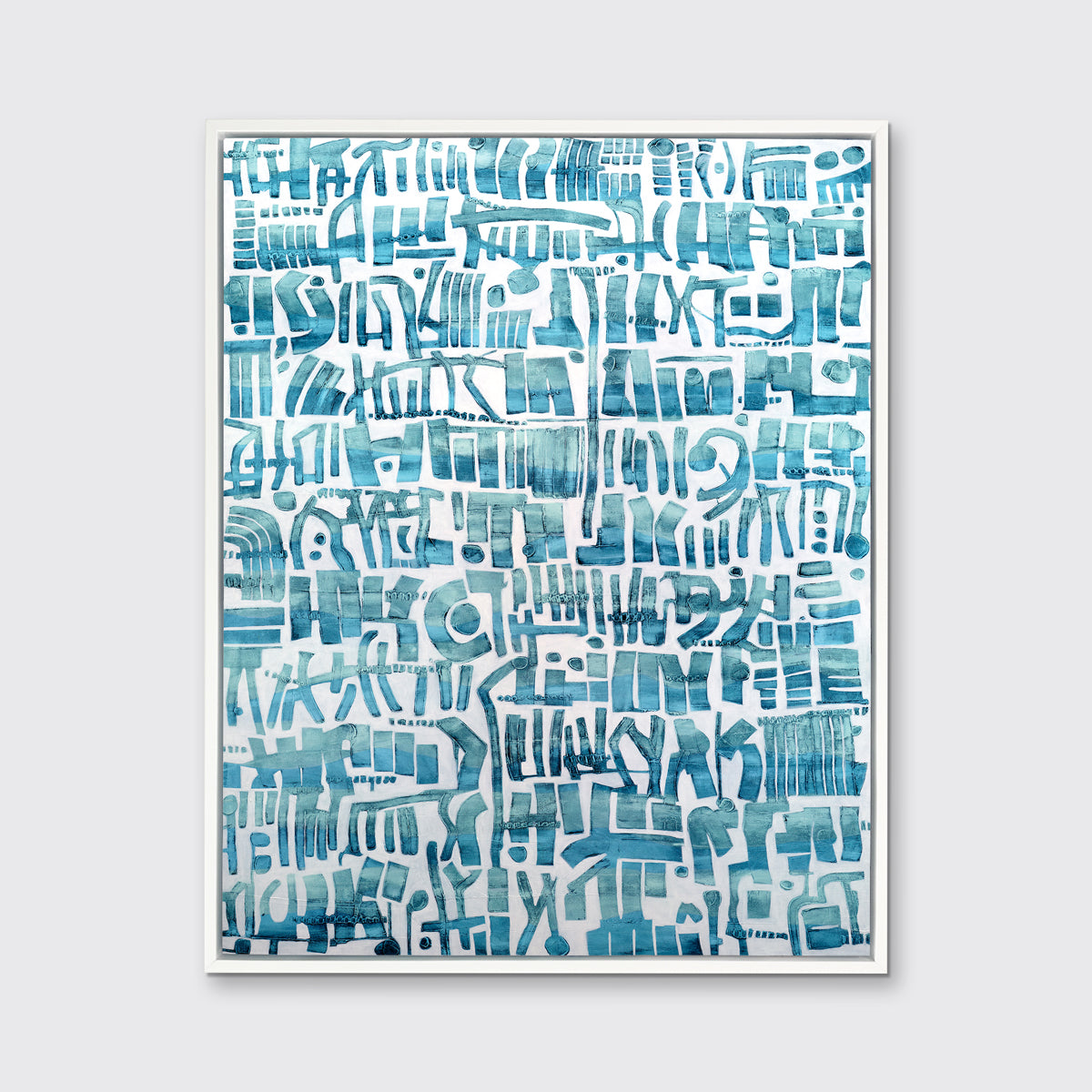A teal and white abstract shapes print in a white floater frame hangs on a white wall.