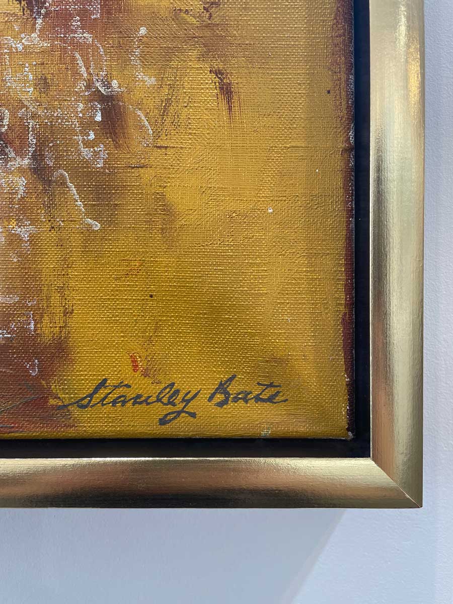 A close up of the artist's signature in the bottom right hand corner.