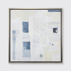 A white, pale yellow and slate blue abstract print in a silver floater frame hangs on a white wall.