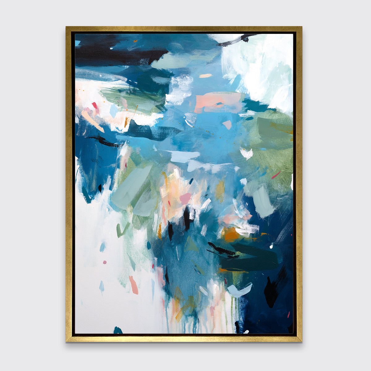 A blue abstract print in a gold floater frame hangs on a white wall.