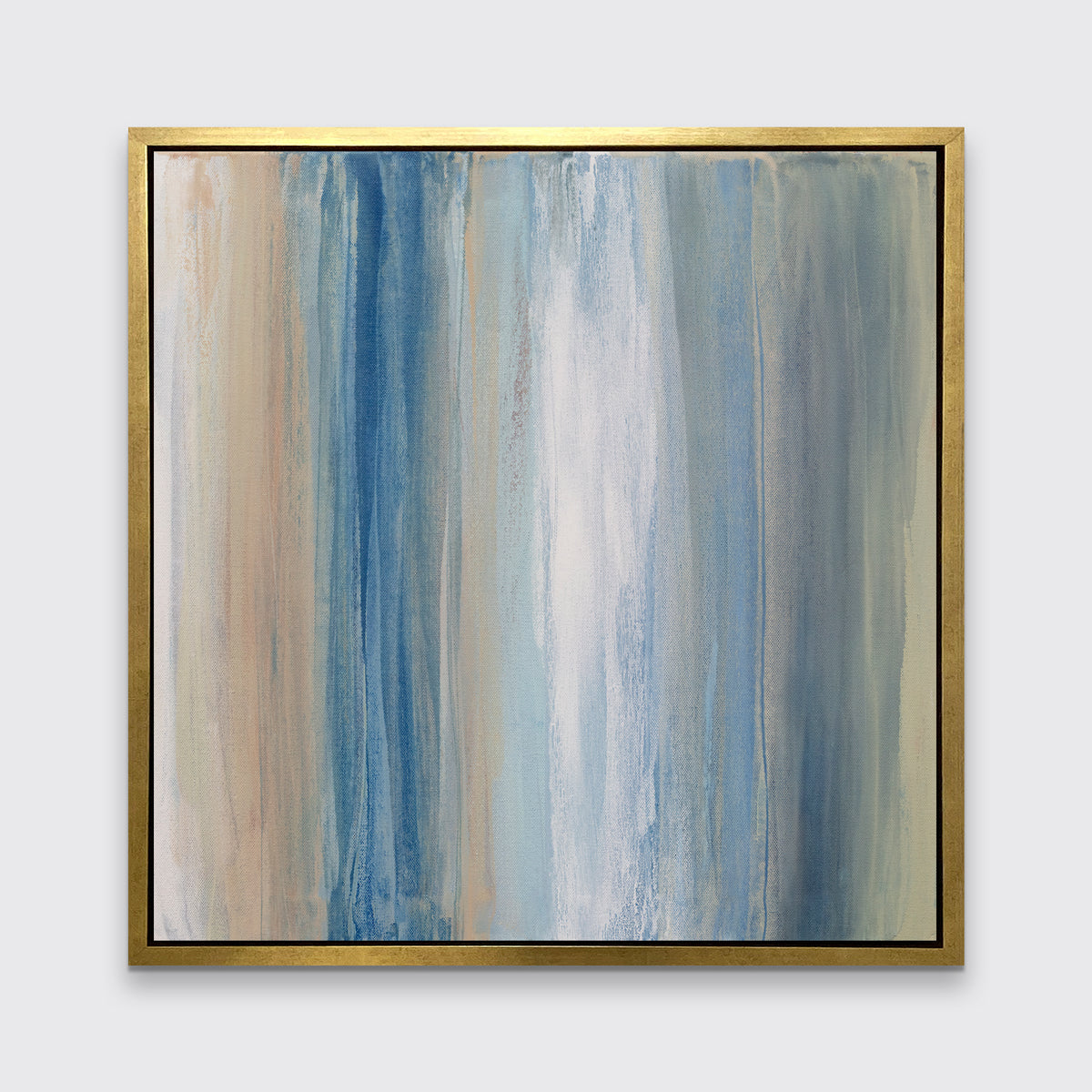 A blue, white, orange and grey abstract print in a gold floater frame hangs on a white wall.