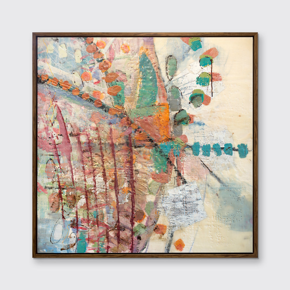 A multicolored abstract print in an oak wood floater frame hangs on a white wall.