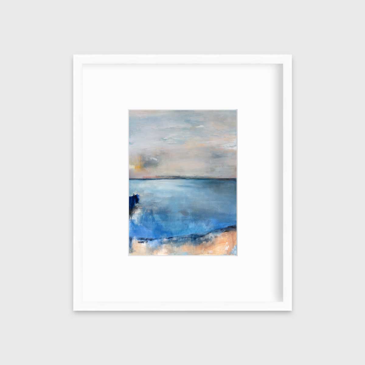 A blue and grey abstract print in a white frame with a mat hangs on a white wall.