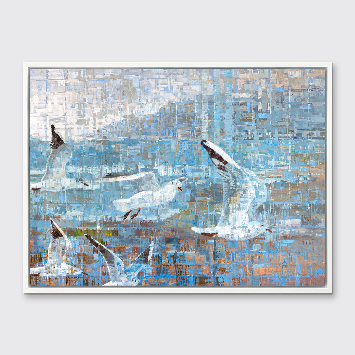 A teal and white geometric abstract print of birds flying together in a white floater frame hangs on a white wall.