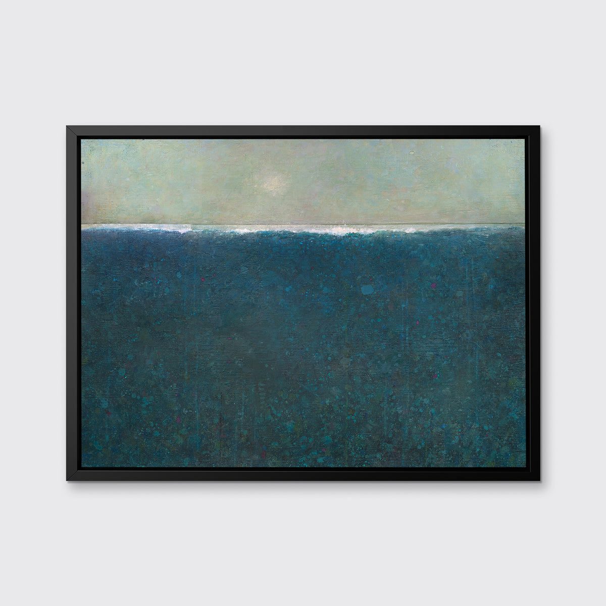 A deep blue abstract landscape print in a black floater frame hangs on a white wall.