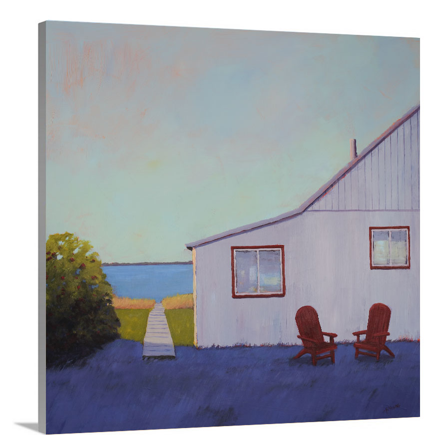 A side-angle view of a blue, lavender and light purple contemporary seascape print with a beach house, two red adirondack chairs and a walkway leading to the water on canvas.