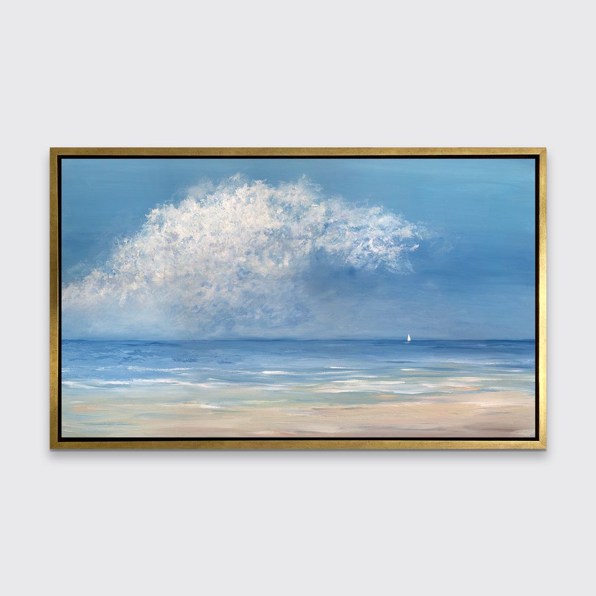 An impressionistic seascape canvas print in a gold floater frame hangs on a white wall.