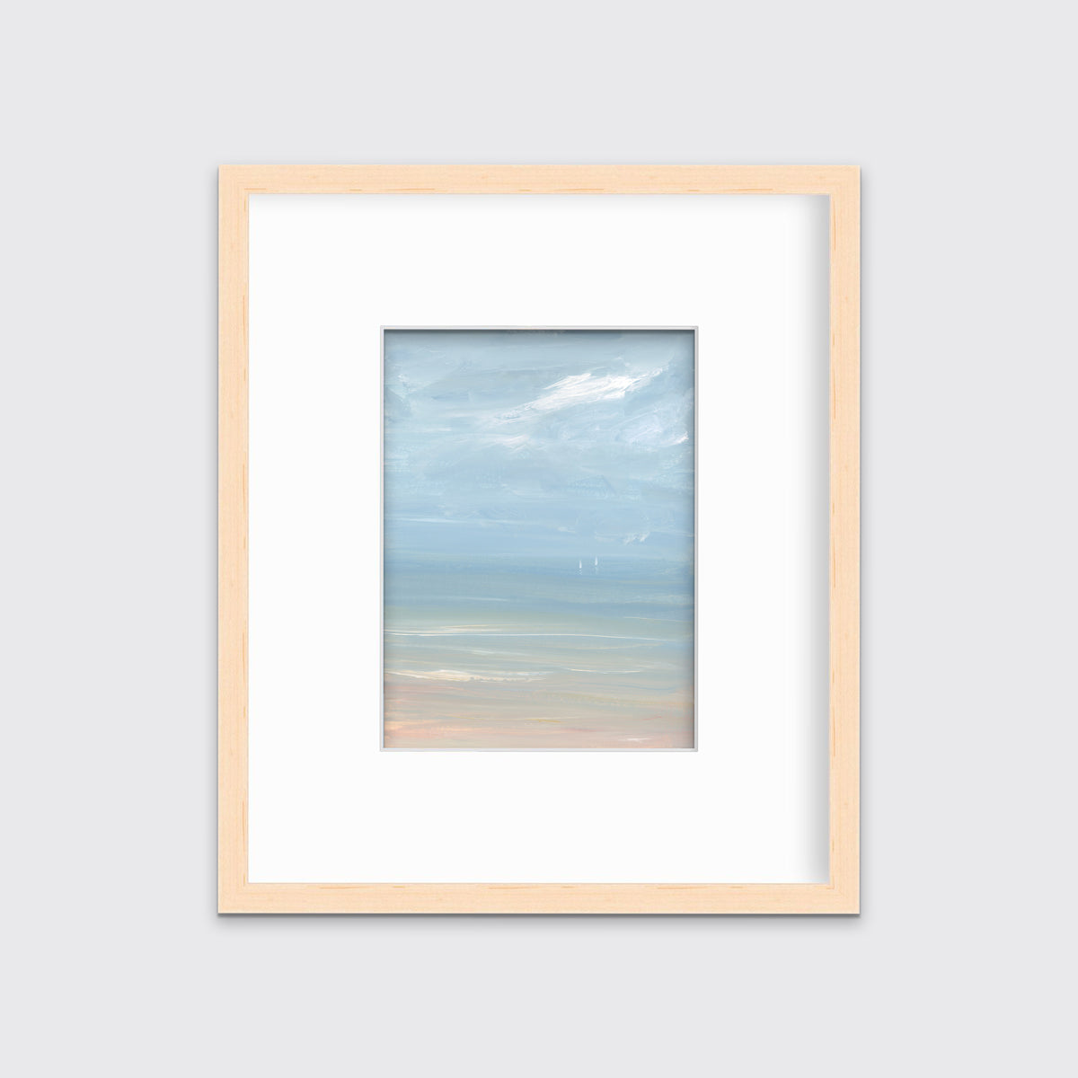 A white, blue and beige abstract seascape print in a natural wood frame with a mat hangs on a white wall.