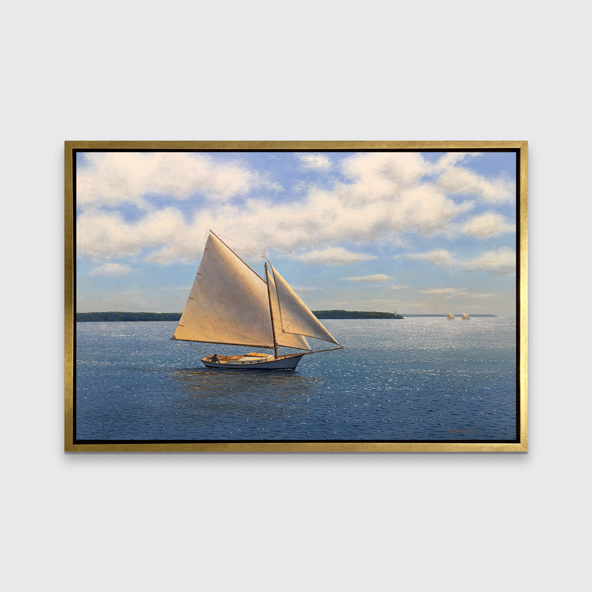 A blue, beige and white seascape print with sailboats in a silver floater frame hangs on a white wall.