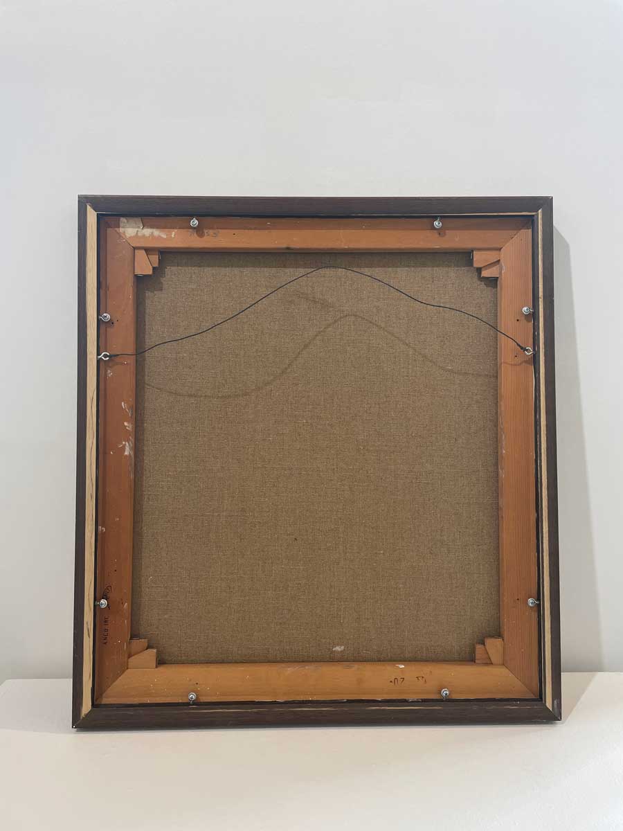 The back of the painting with the title and hanging wire.