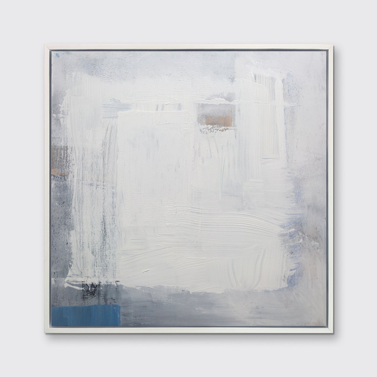 A white, grey and blue abstract print in a white floater frame hangs on a white wall.