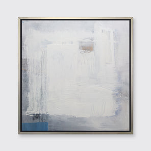 A white, grey and blue abstract print in a silver floater frame hangs on a white wall.