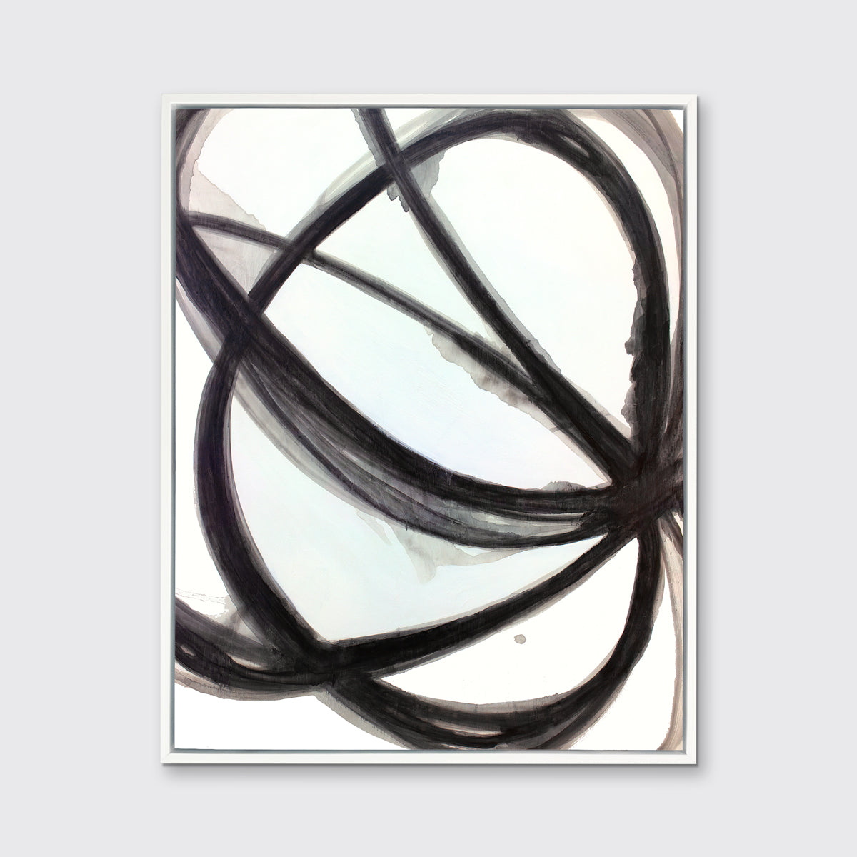 A black and white abstract print in a white floater frame hangs on a light grey wall.