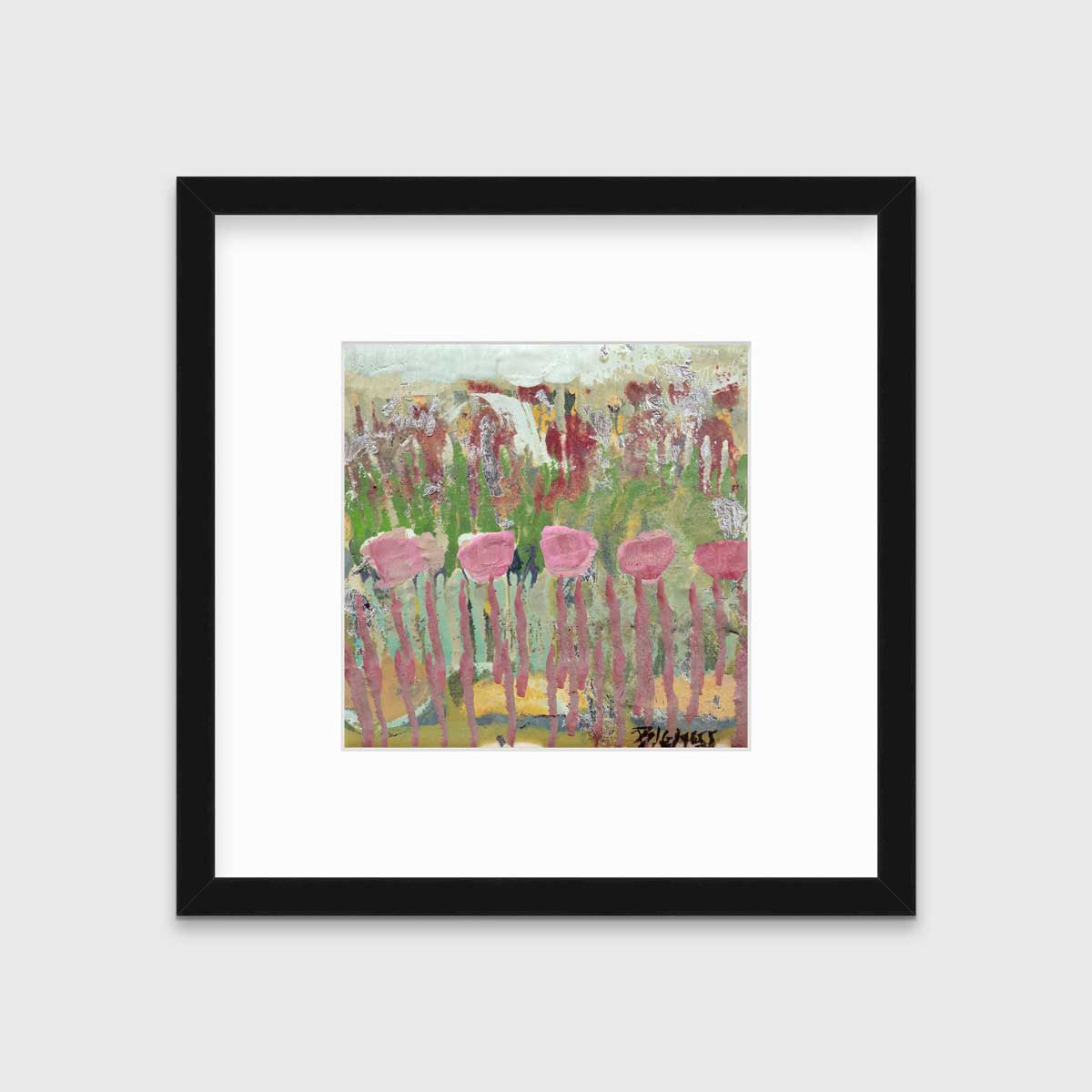 A green, pink and teal abstract floral print in a black frame with a mat hangs on a white wall.