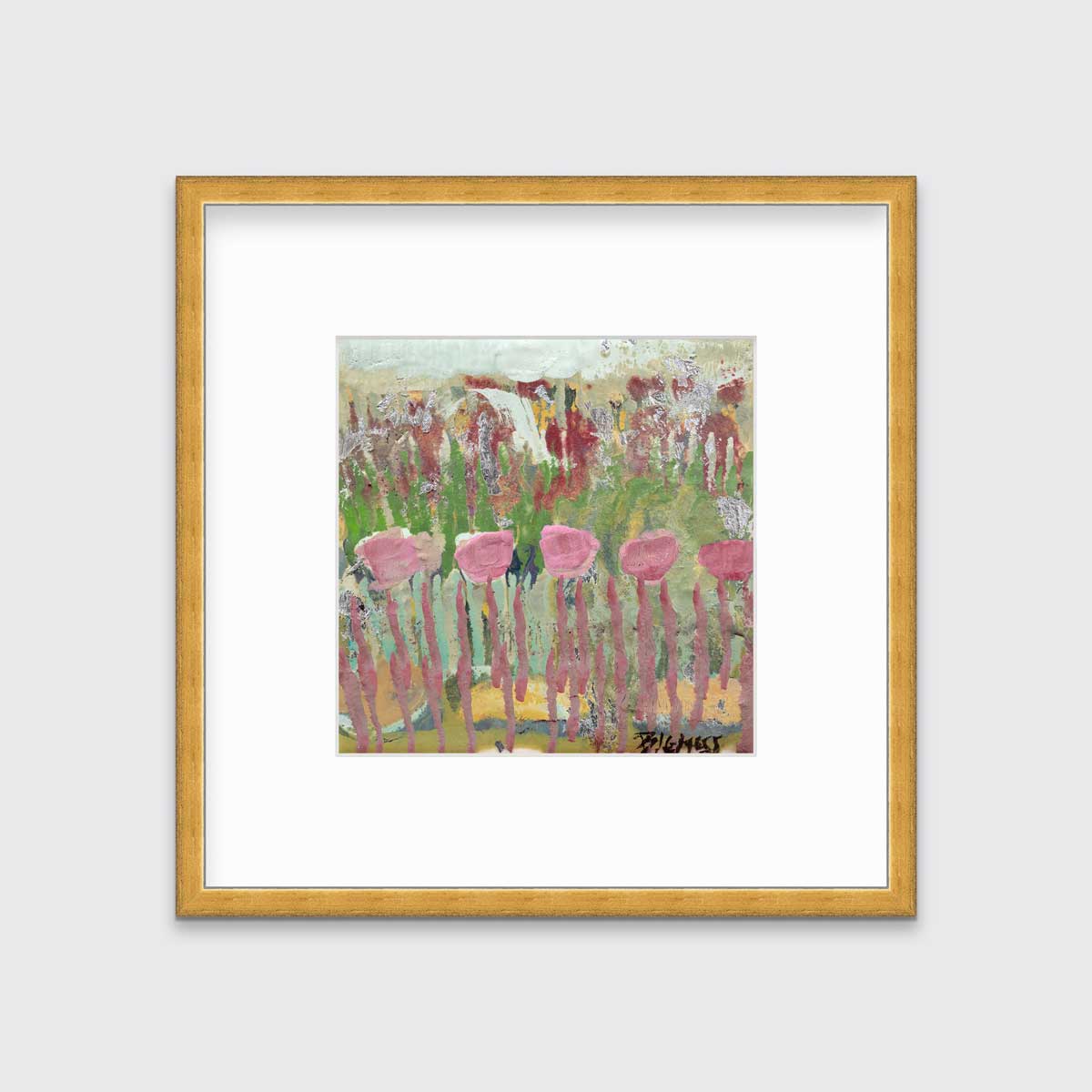 A green, pink and teal abstract floral print in a gold frame with a mat hangs on a white wall.