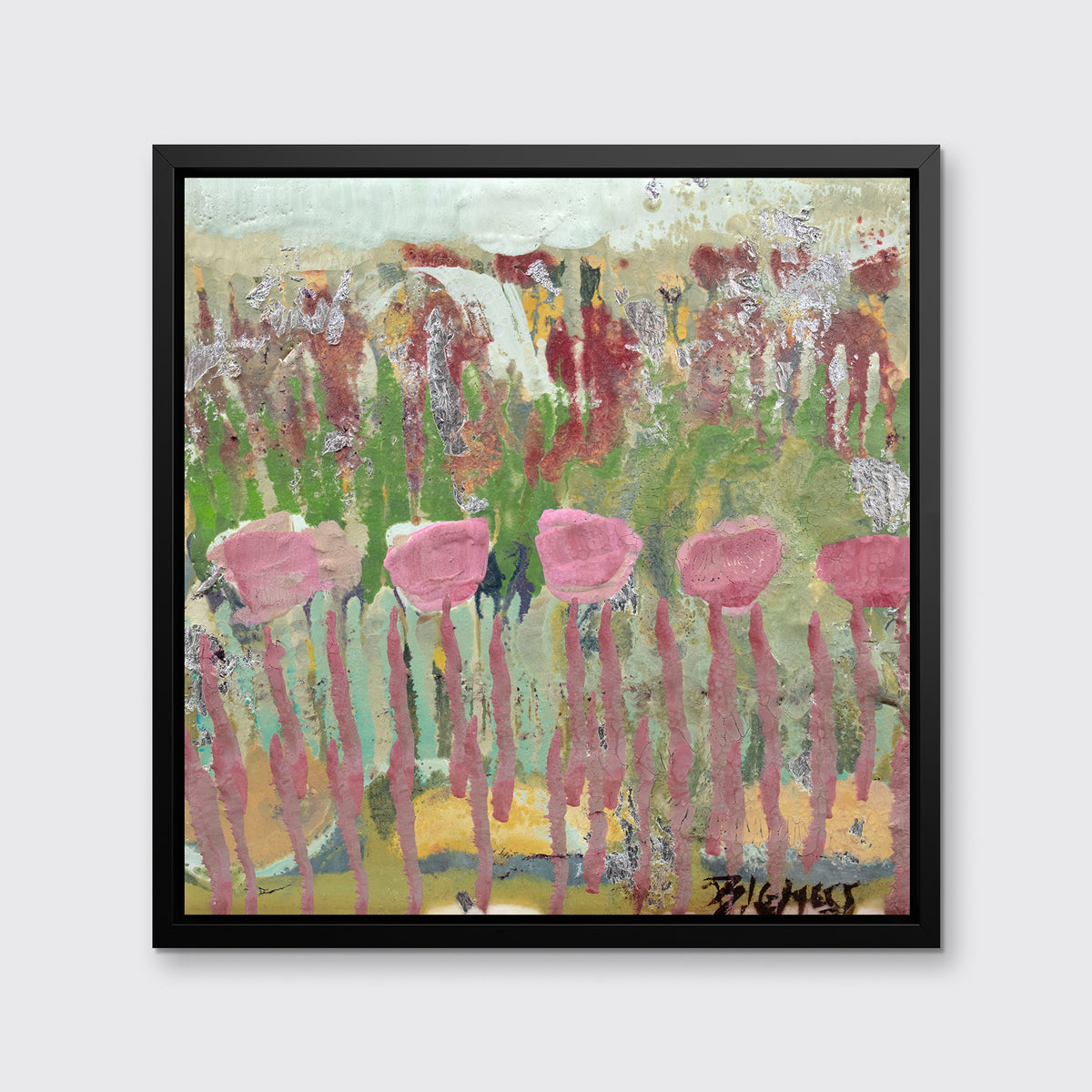 A green, pink and teal abstract floral print in a black floater frame hangs on a white wall.