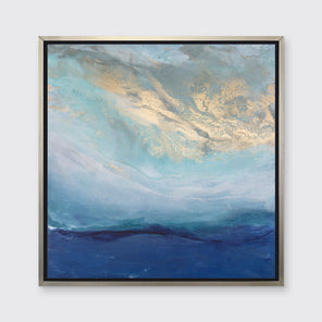 A blue, gold and teal abstract print in a silver floater frame hangs on a white wall.