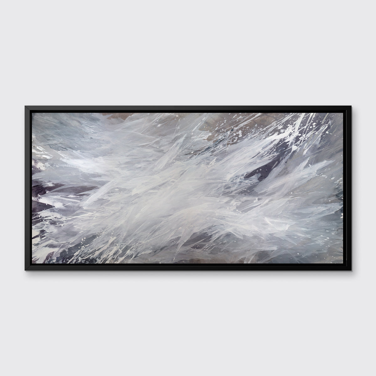 A white, grey and dark grey abstract print in a black floater frame hangs on a white wall.