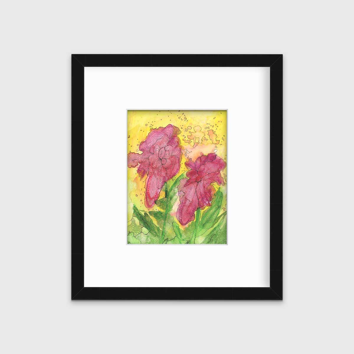 A red, yellow, green and black abstract floral print in a black frame with a mat hangs on a white wall.