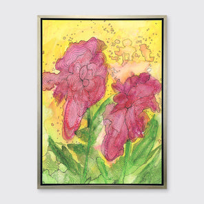A red, yellow, green and black abstract floral print in a silver floater frame hangs on a white wall.