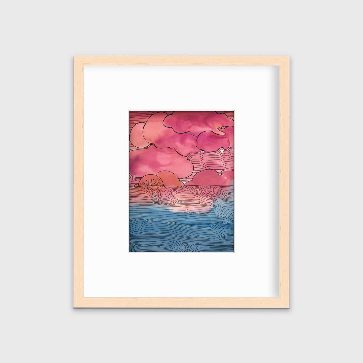A pink, blue and black abstract landscape print in a natural wood frame with a mat hangs on a white wall.