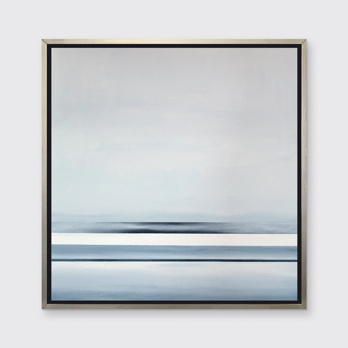 A blue and white linear abstract landscape in a silver floater frame hangs on a white wall.