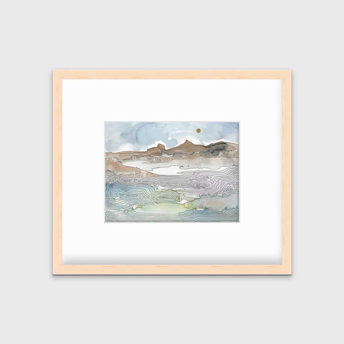 A blue, brown and light green abstract landscape print in a natural wood frame with a mat hangs on a white wall.