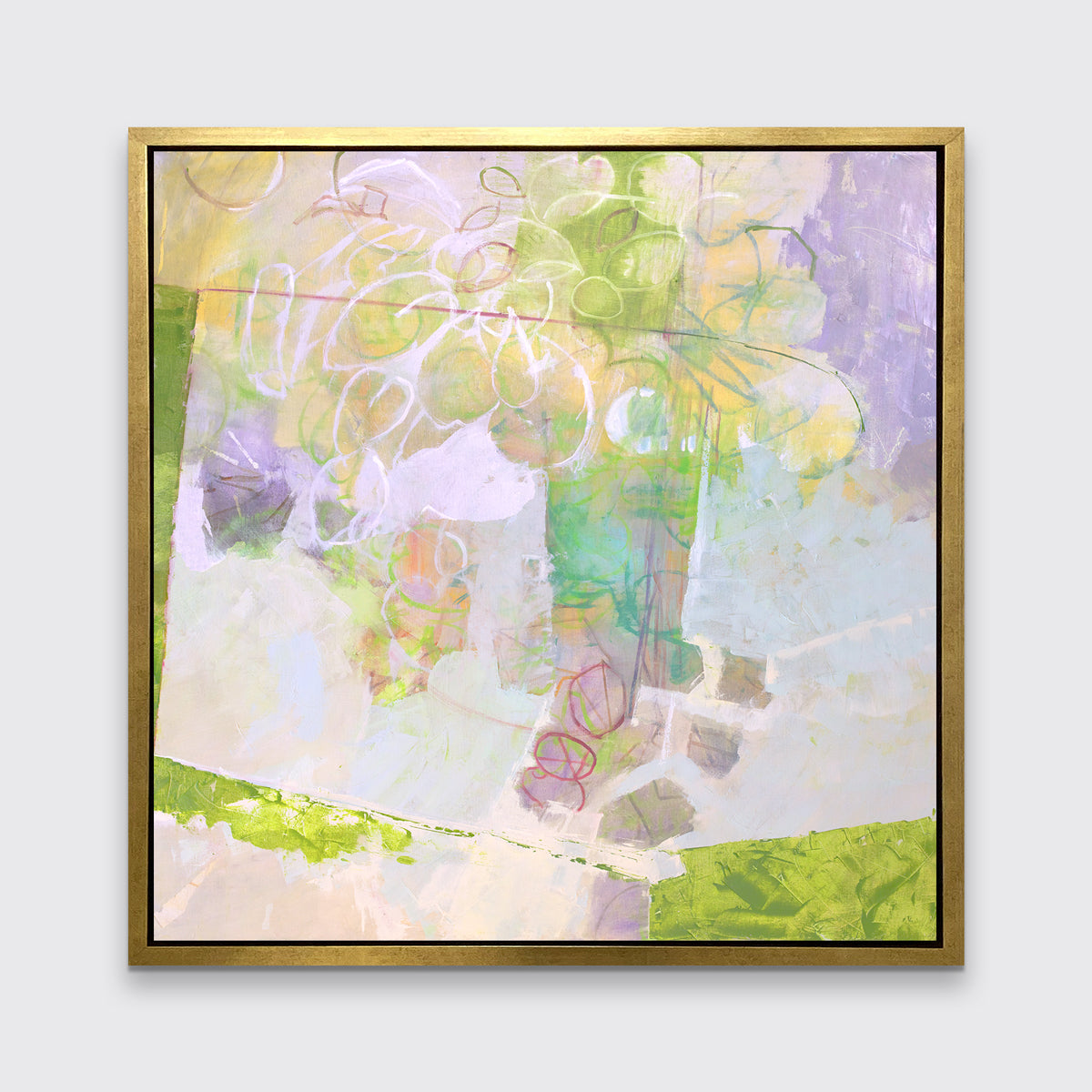A light yellow, lavender and green abstract floral print in a gold floater frame hangs on a white wall.