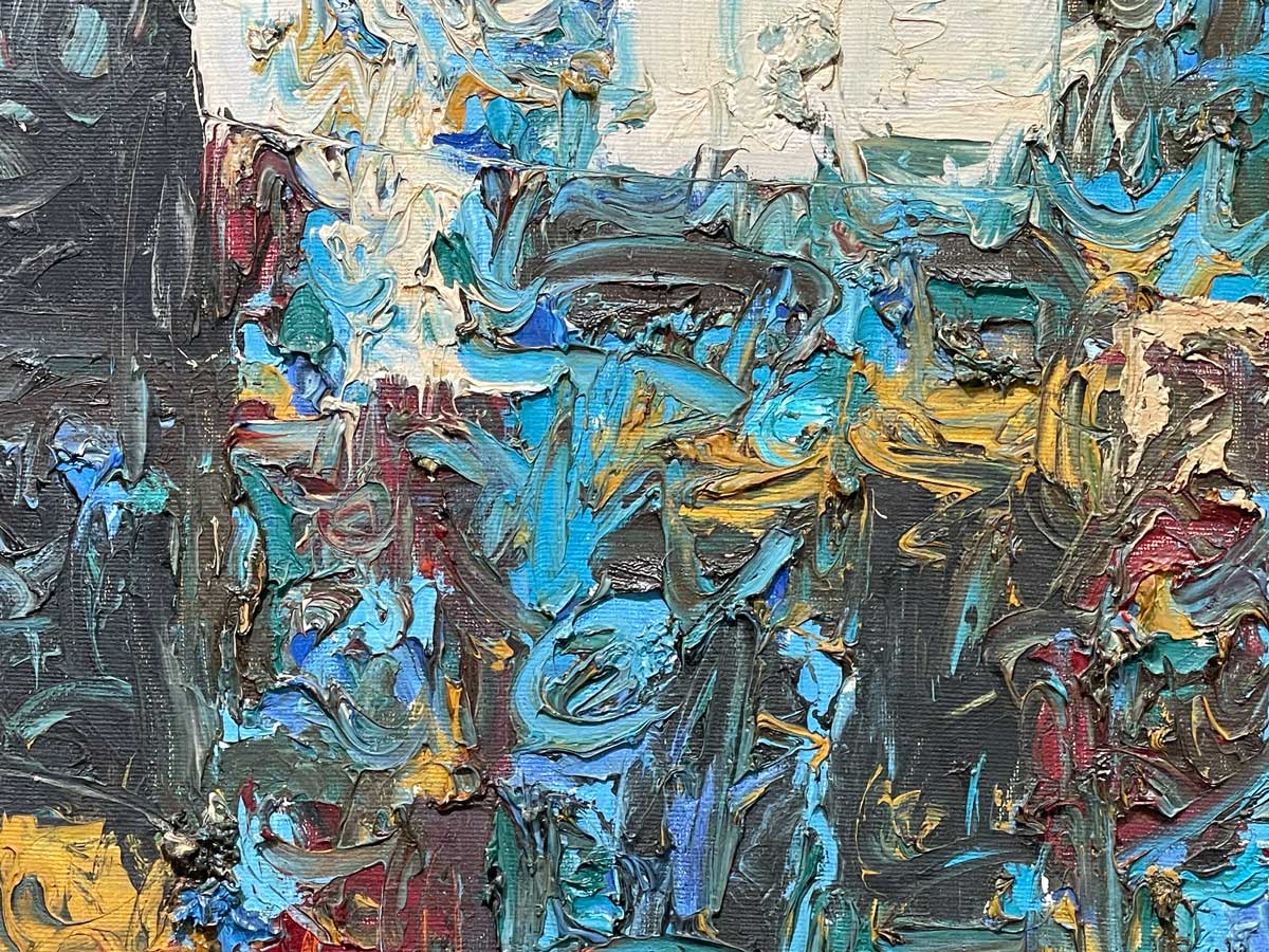 A close up of the texture of the variety of colors of paint.