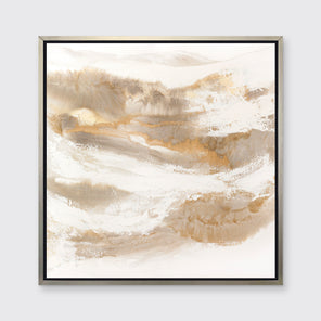 A gold, silver, white and beige abstract print in a silver floater frame hangs on a white wall.