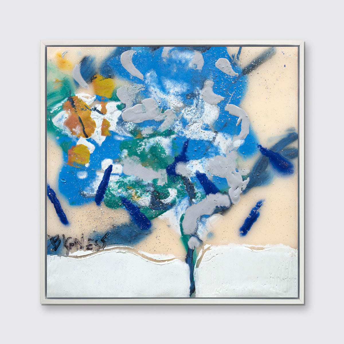 A blue, white, green and orange abstract print in a white floater frame hangs on a white wall.