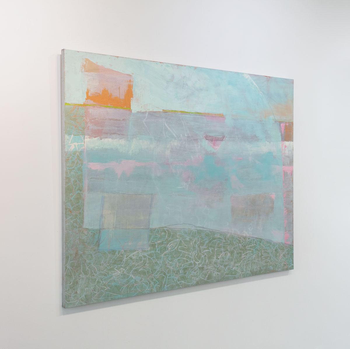 A painting with blue, pink, orange and green tones is seen at an angle.