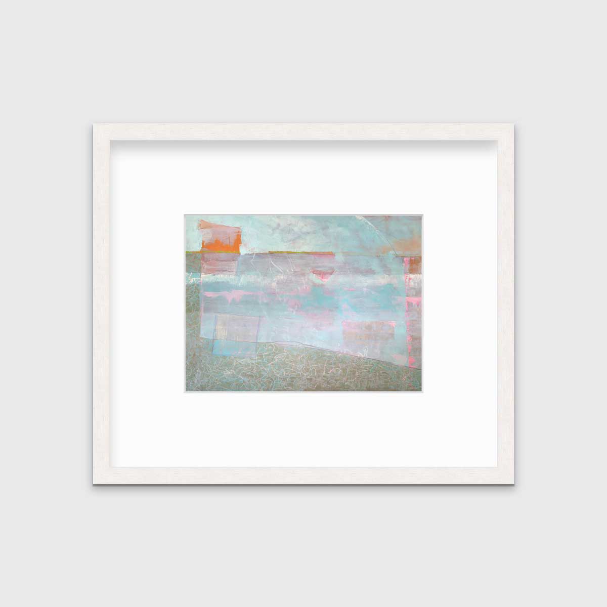 A light blue and pink abstract print in a whitewashed frame with a mat hangs on a white wall.