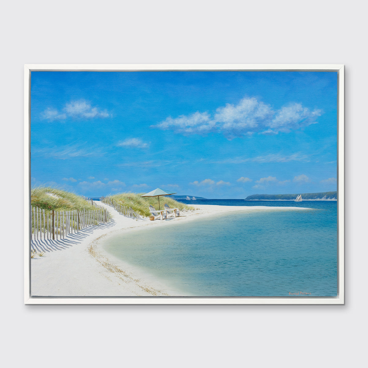 A blue, beige and light green contemporary seascape print in a white floater frame hangs on a white wall.