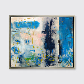A blue, beige, gold and pink abstract figurative print in a silver floater frame hangs on a white wall.