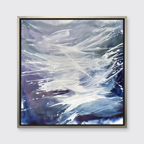 A purple, grey, white and blue abstract print in a silver floater frame hangs on a white wall.