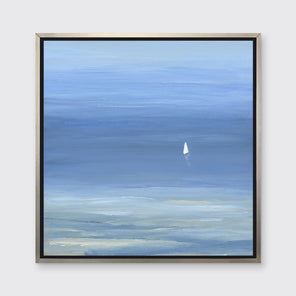 A blue, light green and white abstract seascape print with a small sailboat in a silver floater frame hangs on a white wall.
