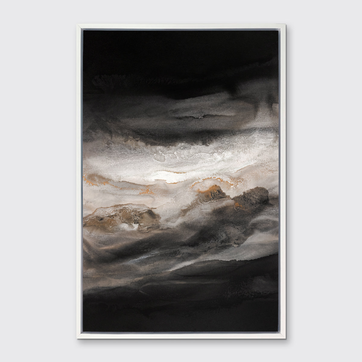 A black, white, beige and gold abstract print in a white floater frame hangs on a white wall.