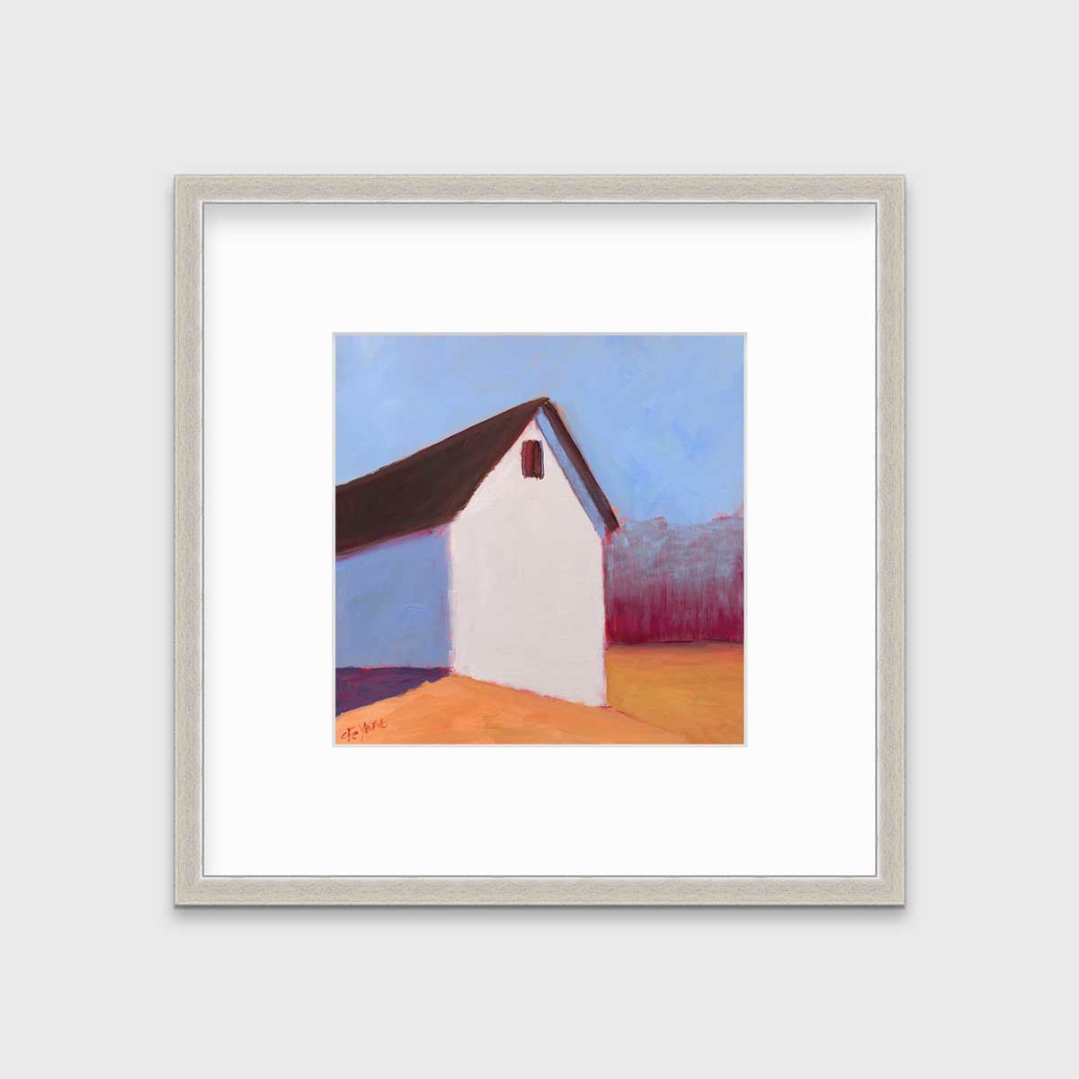 A blue, white, red and orange contemporary barn print in a silver frame with a mat hangs on a white wall.