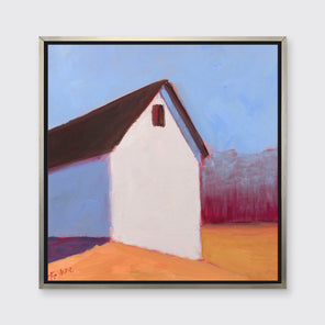 A blue, white, red and orange contemporary barn print in a silver floater frame hangs on a white wall.