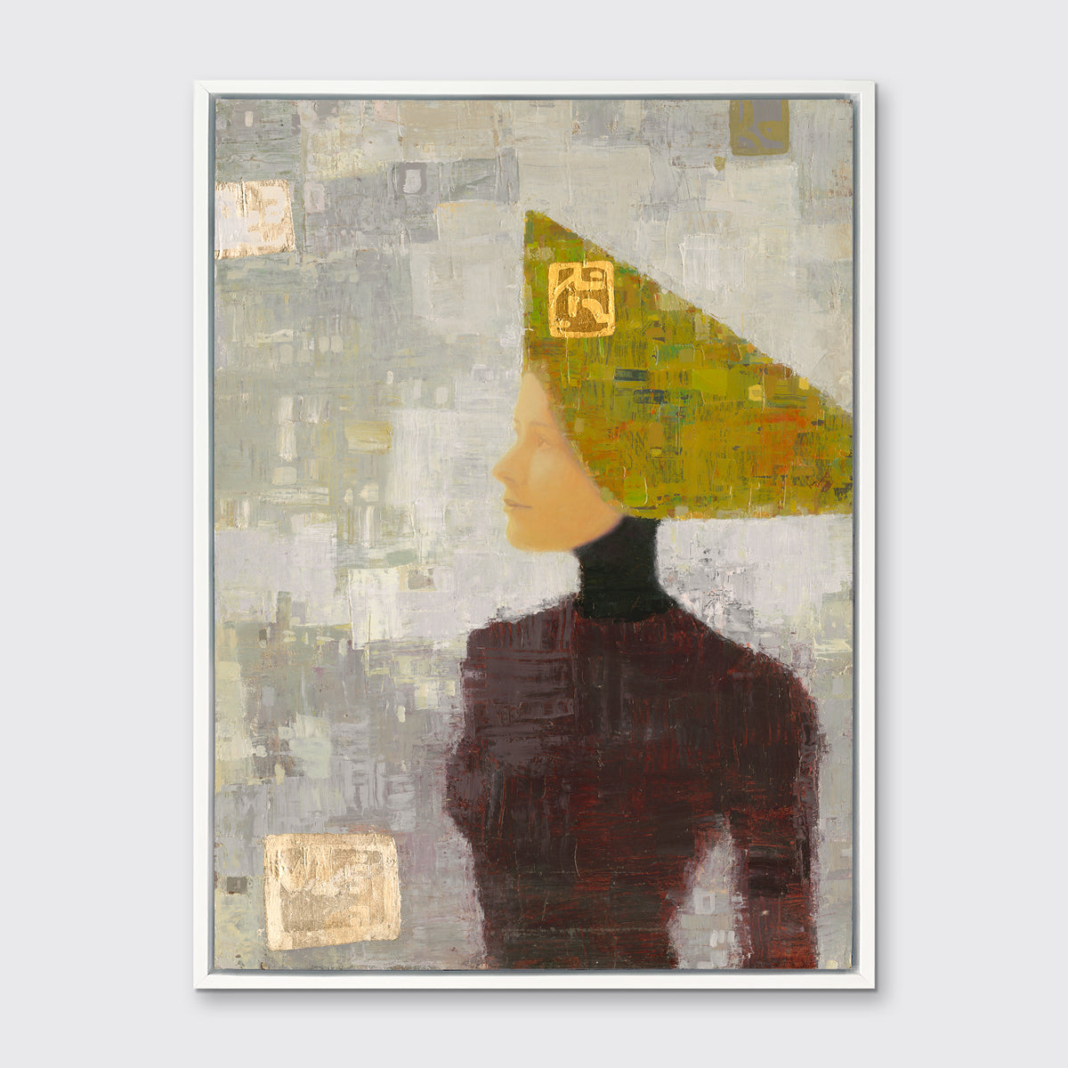 A grey, olive green and dark red abstract print of a woman with a headpiece in a white floater frame hangs on a white wall.