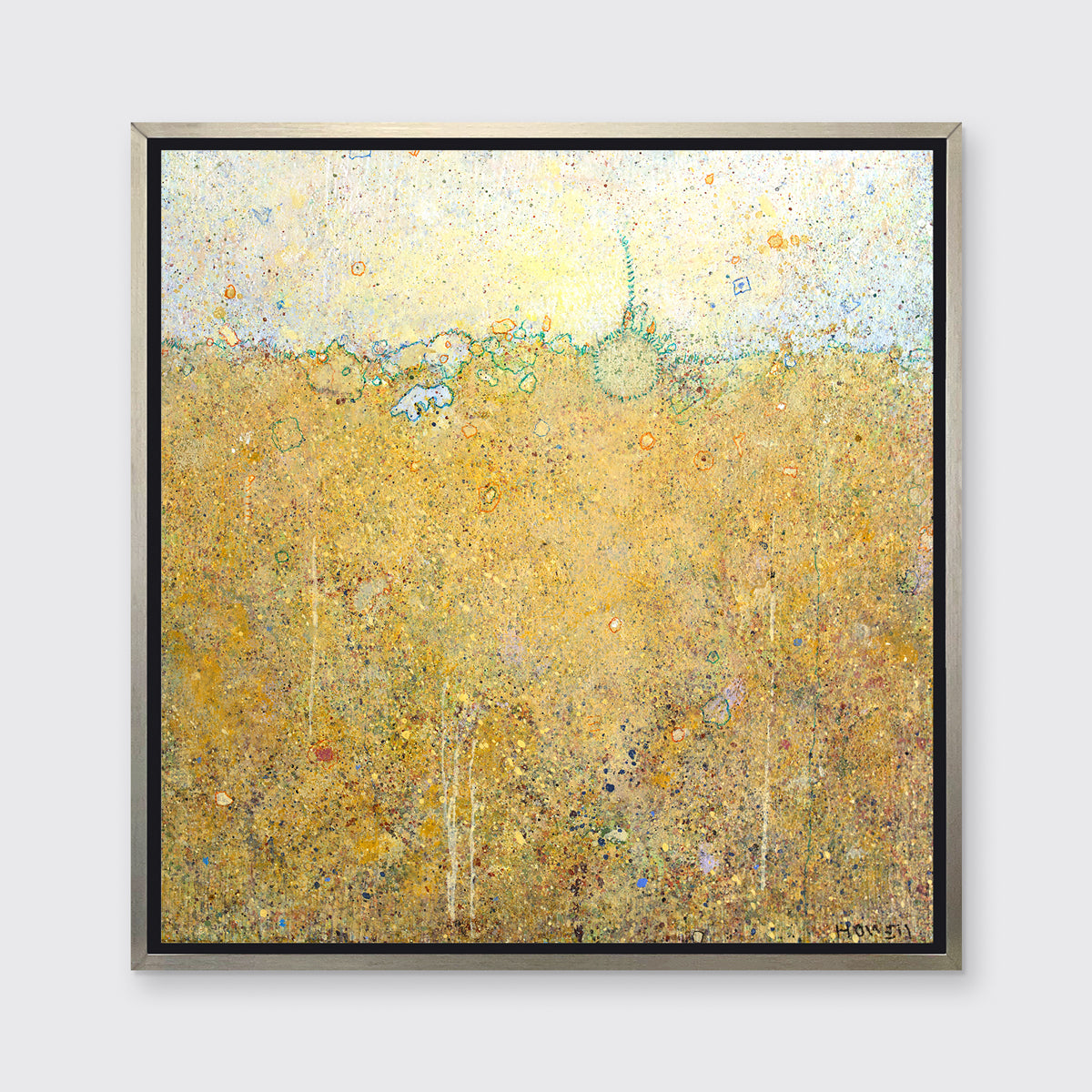 A dark yellow abstract landscape by Elwood Howell in a silver floater frame hangs on a white wall.